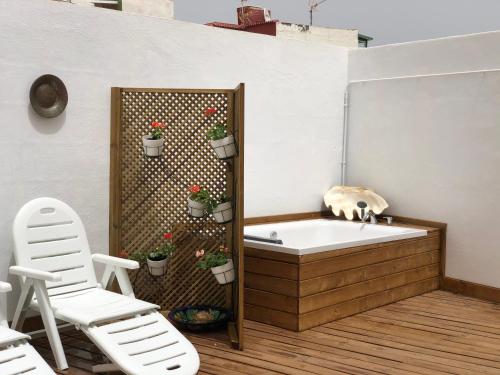 a bath tub with a cat sitting on top of it at Punta Brava Relax in Puerto de la Cruz