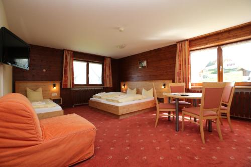 Postel nebo postele na pokoji v ubytování T3 Alpenhotel Garfrescha