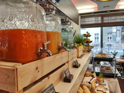 a display case with many jars of honey at Danubia Gate Hotel in Bratislava