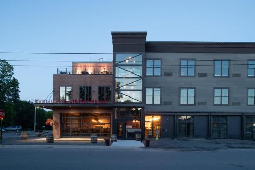 a large brick building with a library in front of it at Cantilever Hotel, Trademark Collection by Wyndham in Ranier
