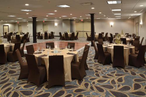 a conference room with tables and chairs in it at Holiday Inn Canton-Belden Village by IHG in Canton