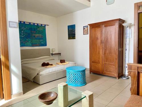a bedroom with a bed and a table in a room at Casa di Marco in Galatina