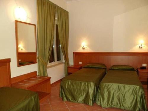 Park Hotel Villamaria tesisinde bir odada yatak veya yataklar