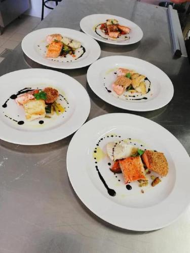 a group of plates of food on a table at Park Hotel Villamaria in Pavona