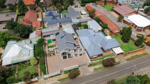 an overhead view of a house with blue roofs at Adato Guesthouse in Potchefstroom