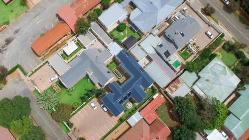 an overhead view of a group of houses at Adato Guesthouse in Potchefstroom