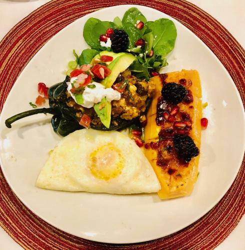 a plate of food with an egg and a salad at Casa Sedona Inn in Sedona