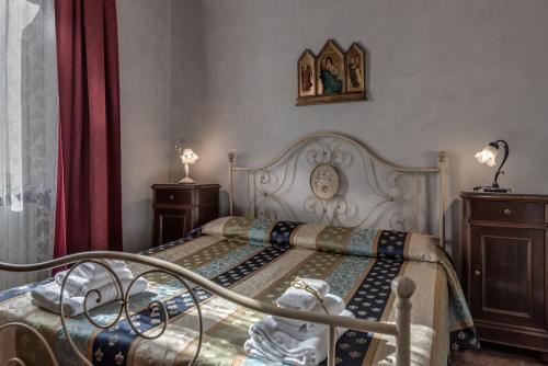 a bedroom with a bed and two night stands at Residence Le Gagli arde in Arezzo