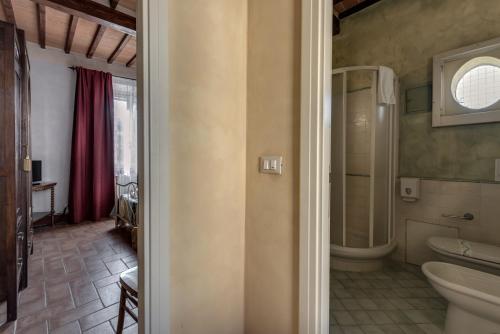 a bathroom with a toilet and a sink at Residence Le Gagli arde in Arezzo