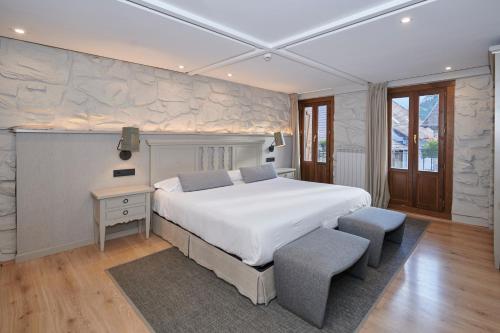 Ένα ή περισσότερα κρεβάτια σε δωμάτιο στο Hostal Lola
