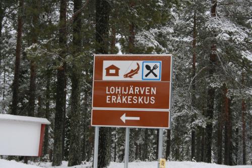 a sign for a park with a sign for a house at Lohijärven Eräkeskus in Lohijärvi
