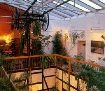 a room with a balcony with plants on it at Landhotel & Reiterhof Schumann in Triptis