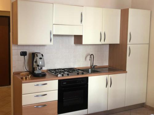 A kitchen or kitchenette at Guest House Via Poerio