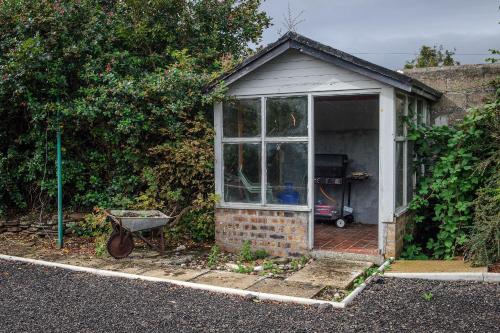 a small house with a window on the side of it at Charming Townhouse on North Coast 500 Route, Wick in Wick