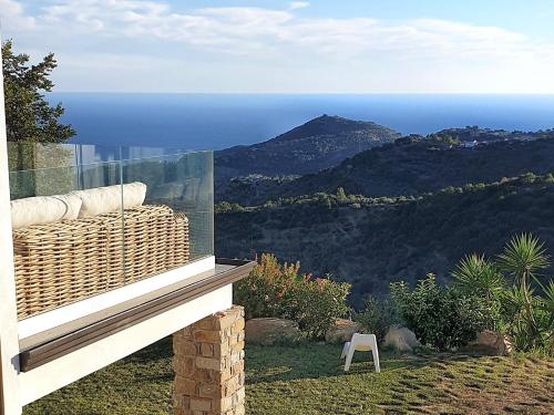 a balcony with a view of the ocean at Villa Anthea in San Mauro Cilento