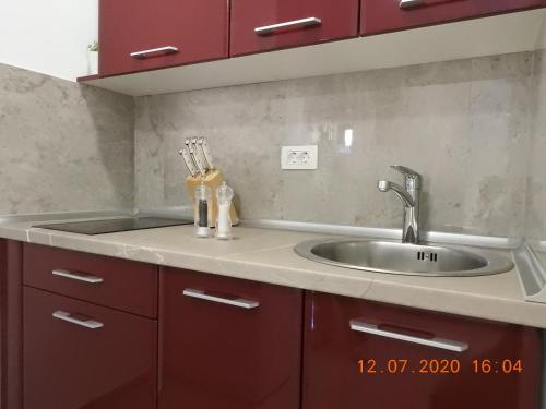 a kitchen with a sink and a counter top at Apartma Ada in Tolmin