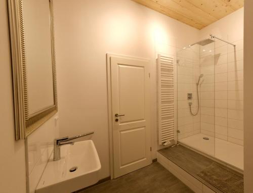 a bathroom with a sink and a shower at Hausdeich in Hamburg