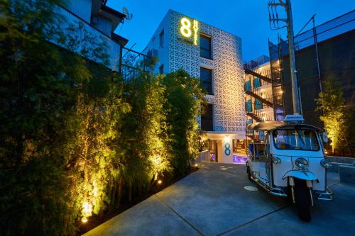a small vehicle parked in front of a building at 8HOTEL Chigasaki in Chigasaki