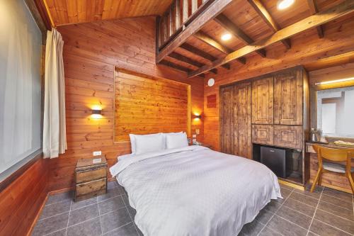 Cama ou camas em um quarto em Yun Xiang Villa 未接待12歲以下孩童