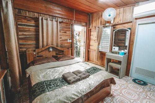 Postel nebo postele na pokoji v ubytování Akchanok Homestay