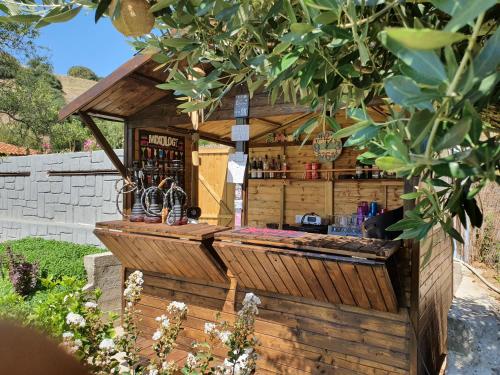 a drink stand in a garden in a yard at Theatro Hotel Odysseon in Kalabaka