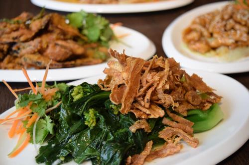 a group of plates of food on a table at Lazenda Hotel in Labuan