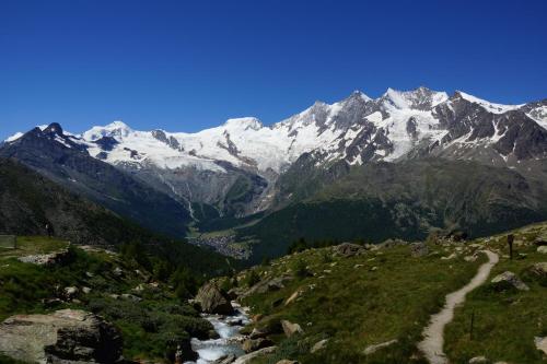a view of a mountain range with snow covered mountains at Haus Aida in Saas-Fee