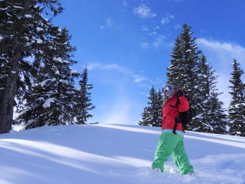 a woman standing on a snow covered slope at Pension Andrea in Fusch an der Glocknerstraße