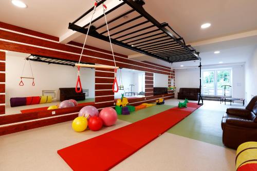 a living room with a lot of balls on the floor at Apartmány pod Mariánskými schody in Albrechtice v Jizerských horách