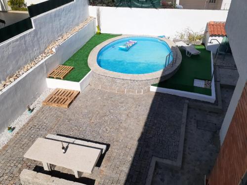 an overhead view of a swimming pool on a patio at Morada do Ultramar in Viana do Castelo