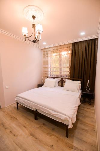 Postel nebo postele na pokoji v ubytování KARNEL Hotel