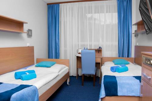 Una cama o camas en una habitación de Ziemowit