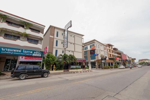a car parked on a city street with buildings at Access Inn Pattaya in Pattaya Central