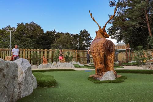 a statue of a deer standing in a park at China Fleet Country Club in Saltash