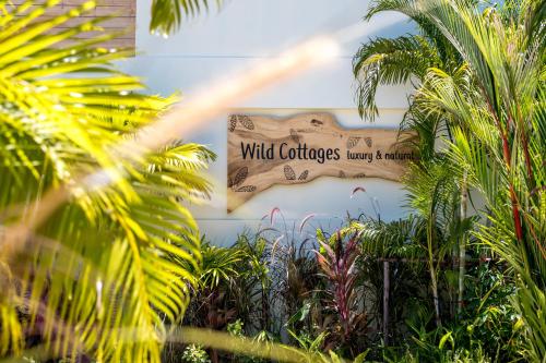 a sign that reads wild california gardensway is shown at Wild Cottages Luxury and Natural - SHA Extra Plus Certified in Lamai