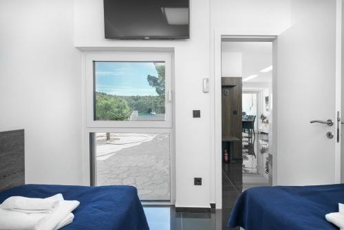 Postel nebo postele na pokoji v ubytování Alexandra Apartments