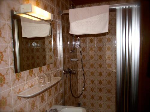 a bathroom with a shower and a sink at Bio & Vegi Pension Krennleiten in Schönau am Königssee