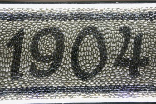 a sign with the word love written on a metal grate at Efchi 1904 in Rhodes Town