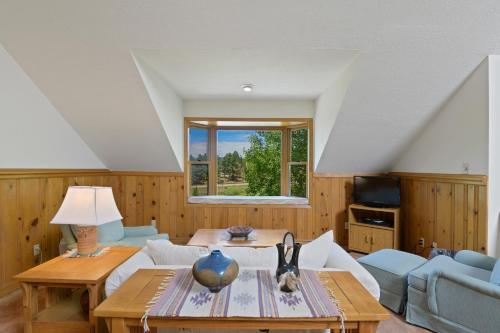 a living room with a couch and a table at Snowfire 312A in Angel Fire