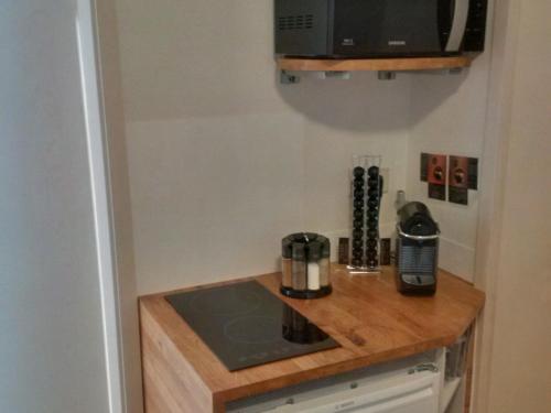 a kitchen with a counter with a coffee maker on it at Ferienwohnungen Stegen in Stegen