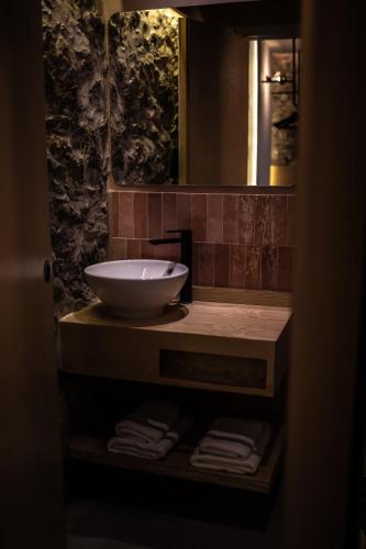 a bathroom with a sink and a mirror at Old Town SXVI - Adults Only in Telde
