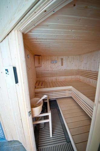 a large wooden sauna with a bench in it at La Ferme du Cayla in Linac