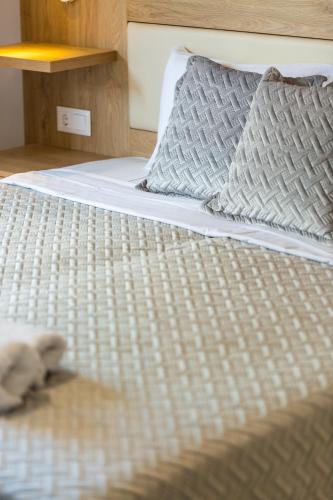 Letto o letti in una camera di Gorgona Hotel