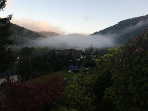 a view of a valley with clouds in the mountains at Hills Hut in Langelsheim