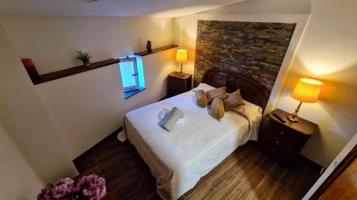 Кровать или кровати в номере Casa Catraia Gondramaz no Pulmão da Serra da Lousã