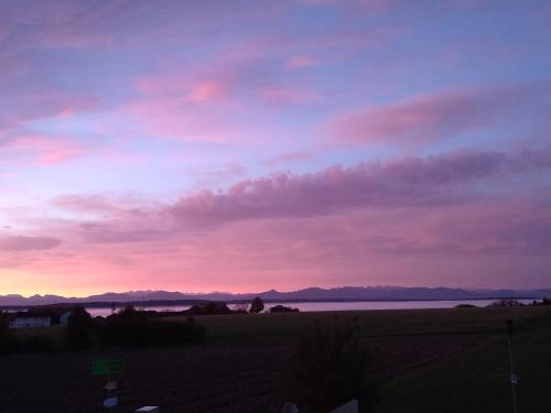a sunset view from the balcony of a house at Wagnerhof in Au am Inn