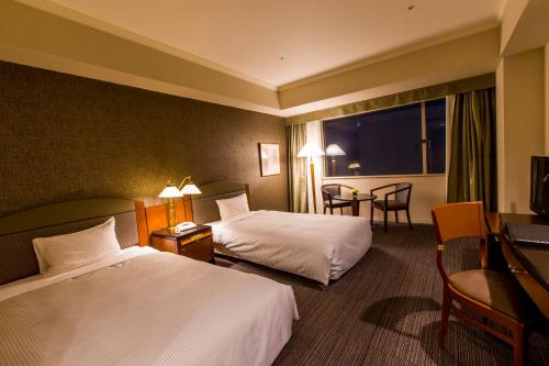Krevet ili kreveti u jedinici u objektu The QUBE Hotel Chiba