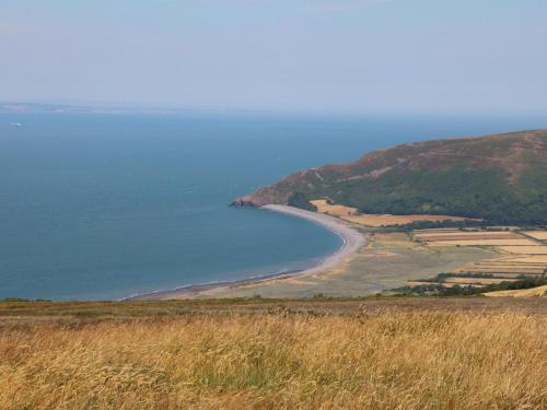 a view of a beach from a hill at 3 Lowerbourne Terrace in Minehead