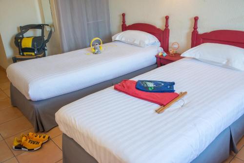 Un ou plusieurs lits dans un hébergement de l'établissement Hotel du Forum