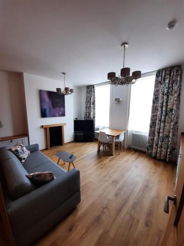 a living room with a couch and a table at Number 8 in Canterbury